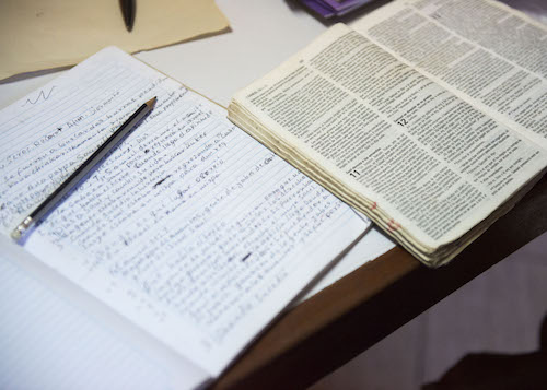 Napo Quechua translation notes spread out on the table